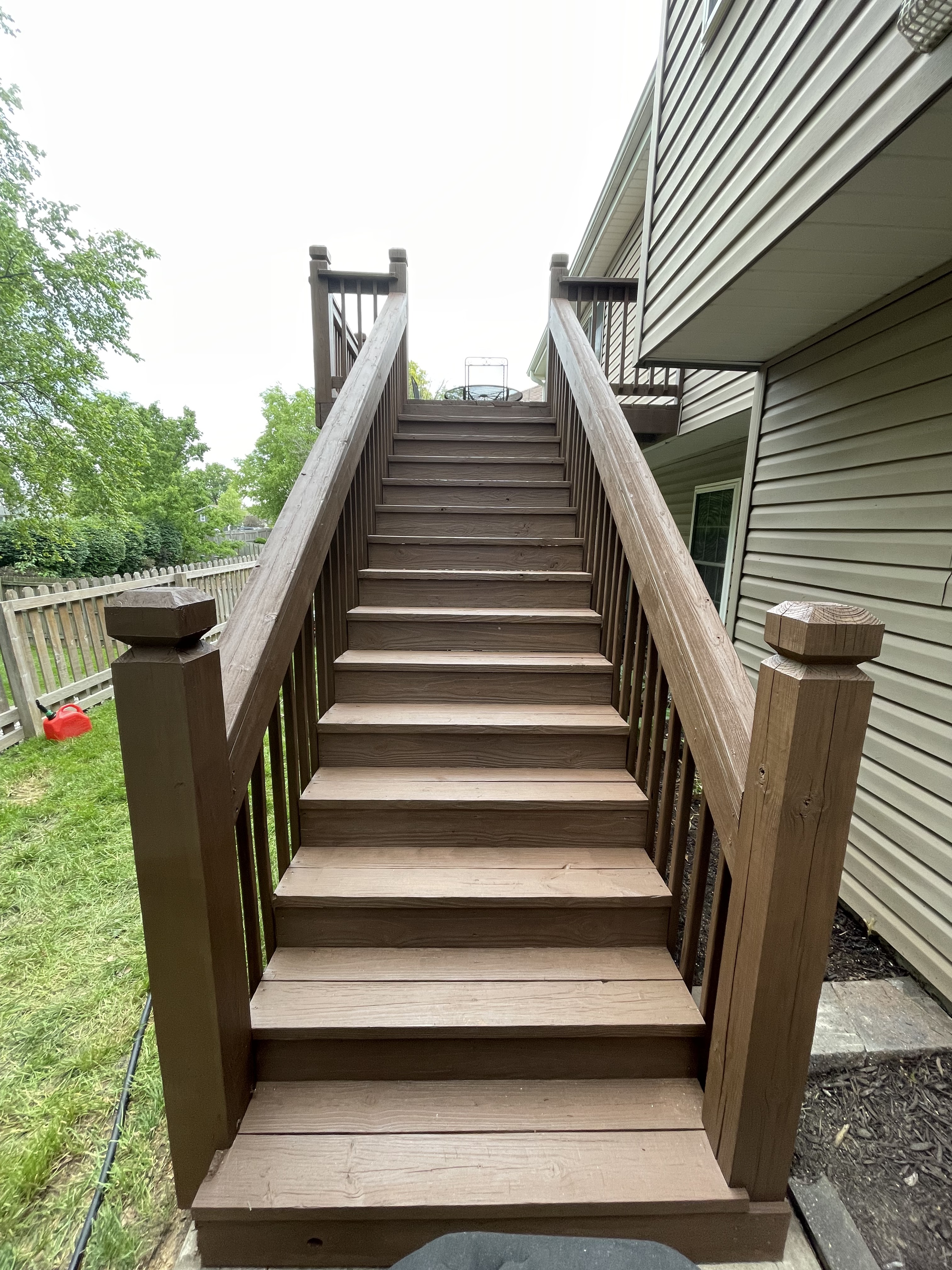 Exterior Staircase & Fence Staining in Belton, MO by Red Letter Painting