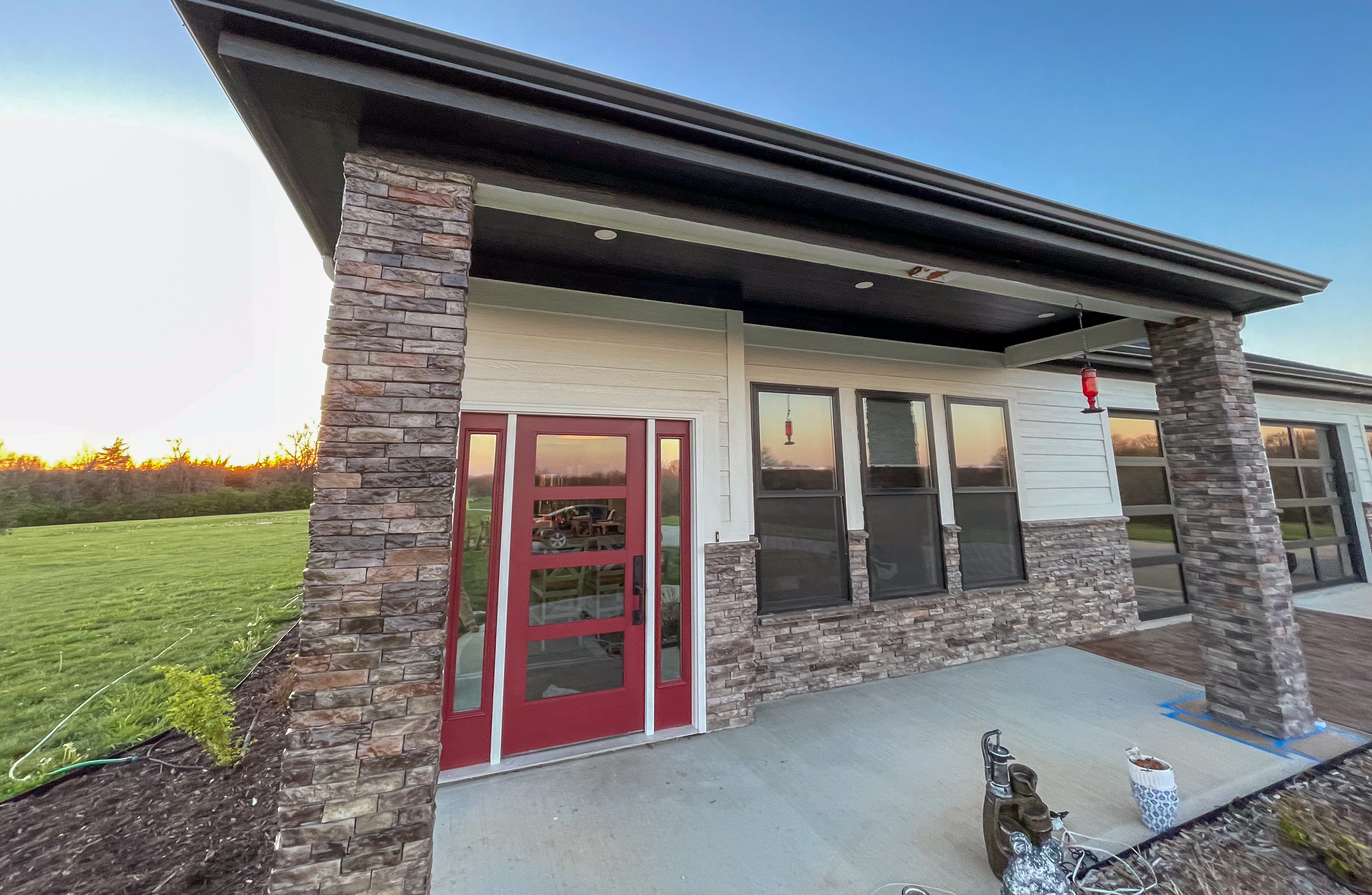 Modern exterior painting with bold accent door by Red Letter Painting