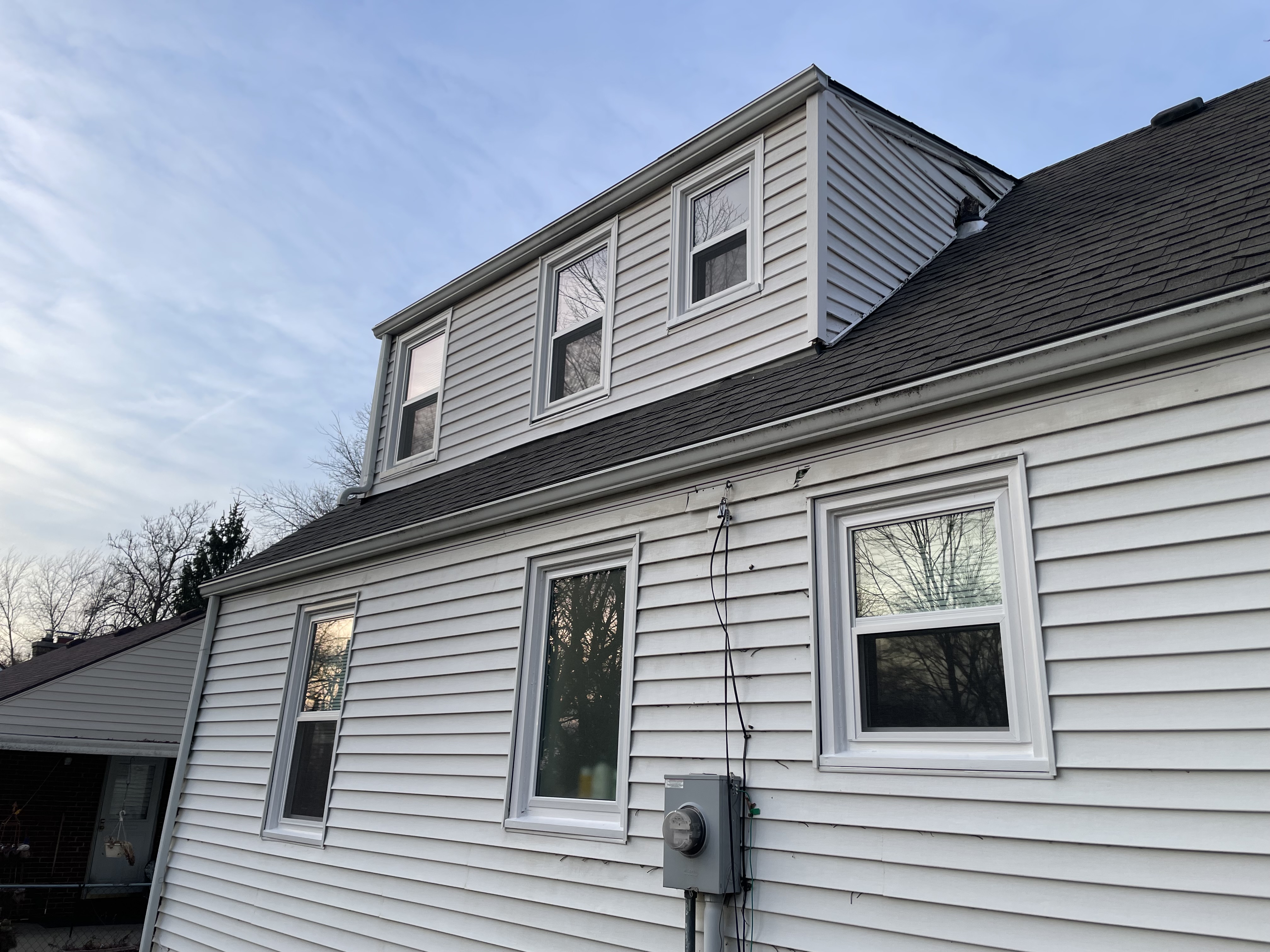Dormer Window Trim and Exterior Siding Painting in Independence, MO by Red Letter Painting