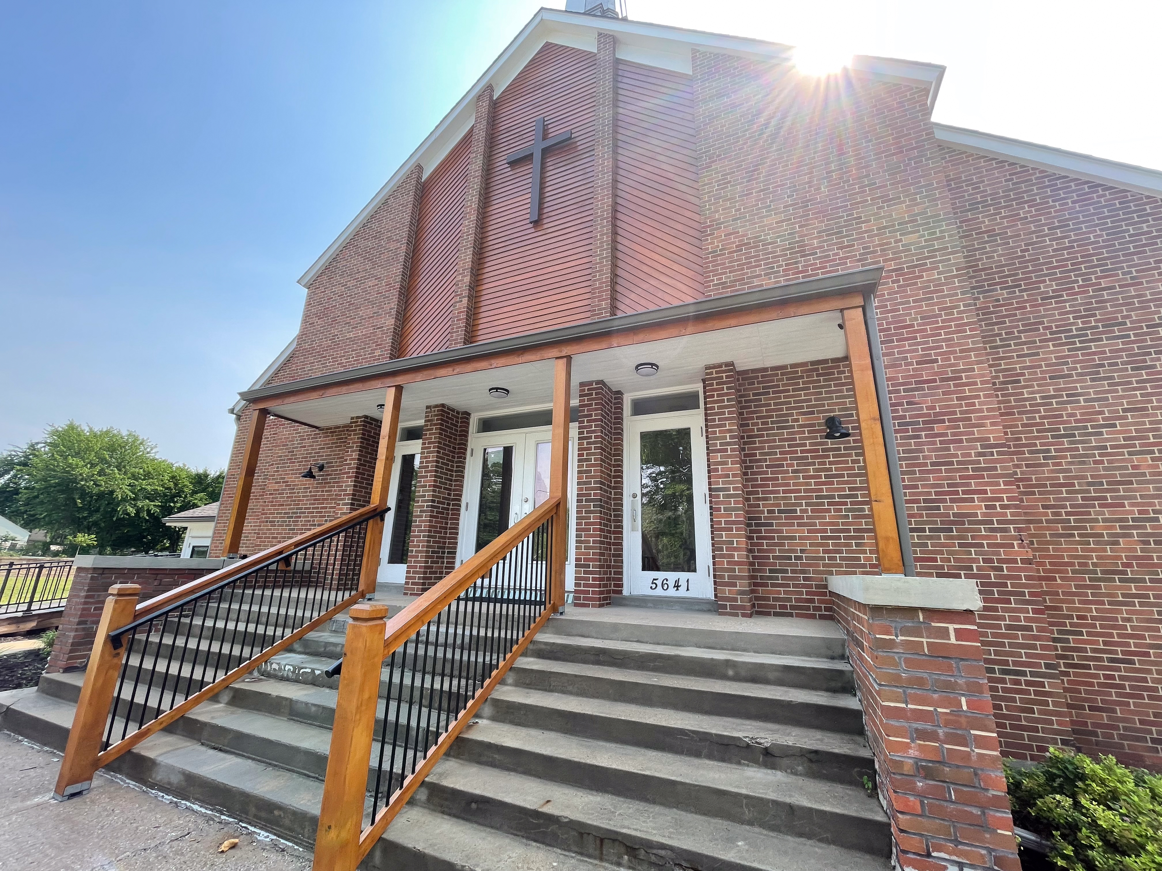 Church Siding and Entryway Timber Refinishing in Prairie Village, KS by Red Letter Painting